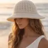 Crochet bucket hat pattern PDF showing baby and toddler sizes with I-cord ties