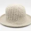 Close-up of alternating single and double crochet stitch texture on cotton bucket hat