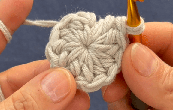 Crochet bucket hat detail — alternating single crochet and double crochet texture in cream cotton