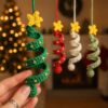 Beaded green crochet spiral Christmas tree ornament with a yellow star topper — beginner PDF pattern