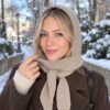 Knit look crochet hooded scarf in cream, hood up, worn by a model Knit look crochet hooded scarf in cream, hood up, worn by a model